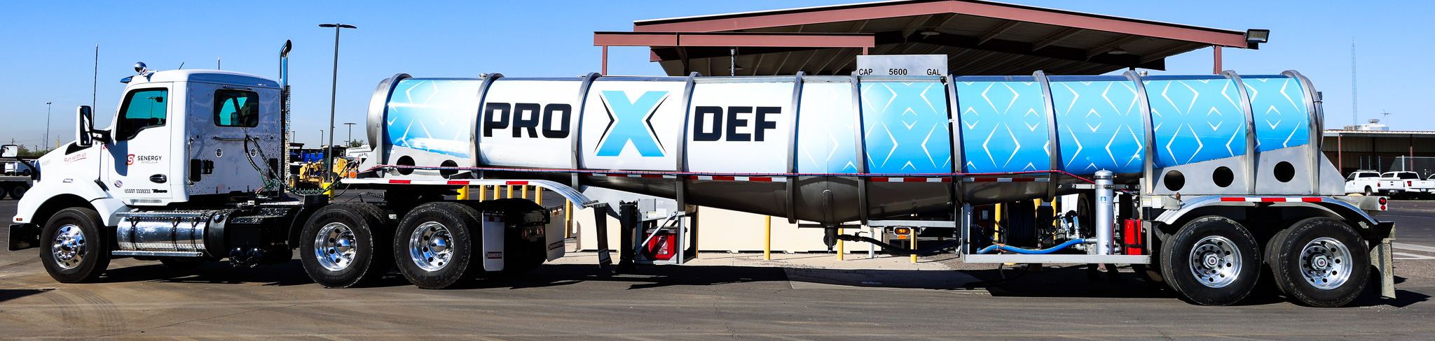 PRO X DEF tanker truck with blue branding parked at a facility